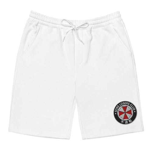 White fleece shorts, front view, with an embroidered Sore Losers Club biotech circle logo on the left leg.