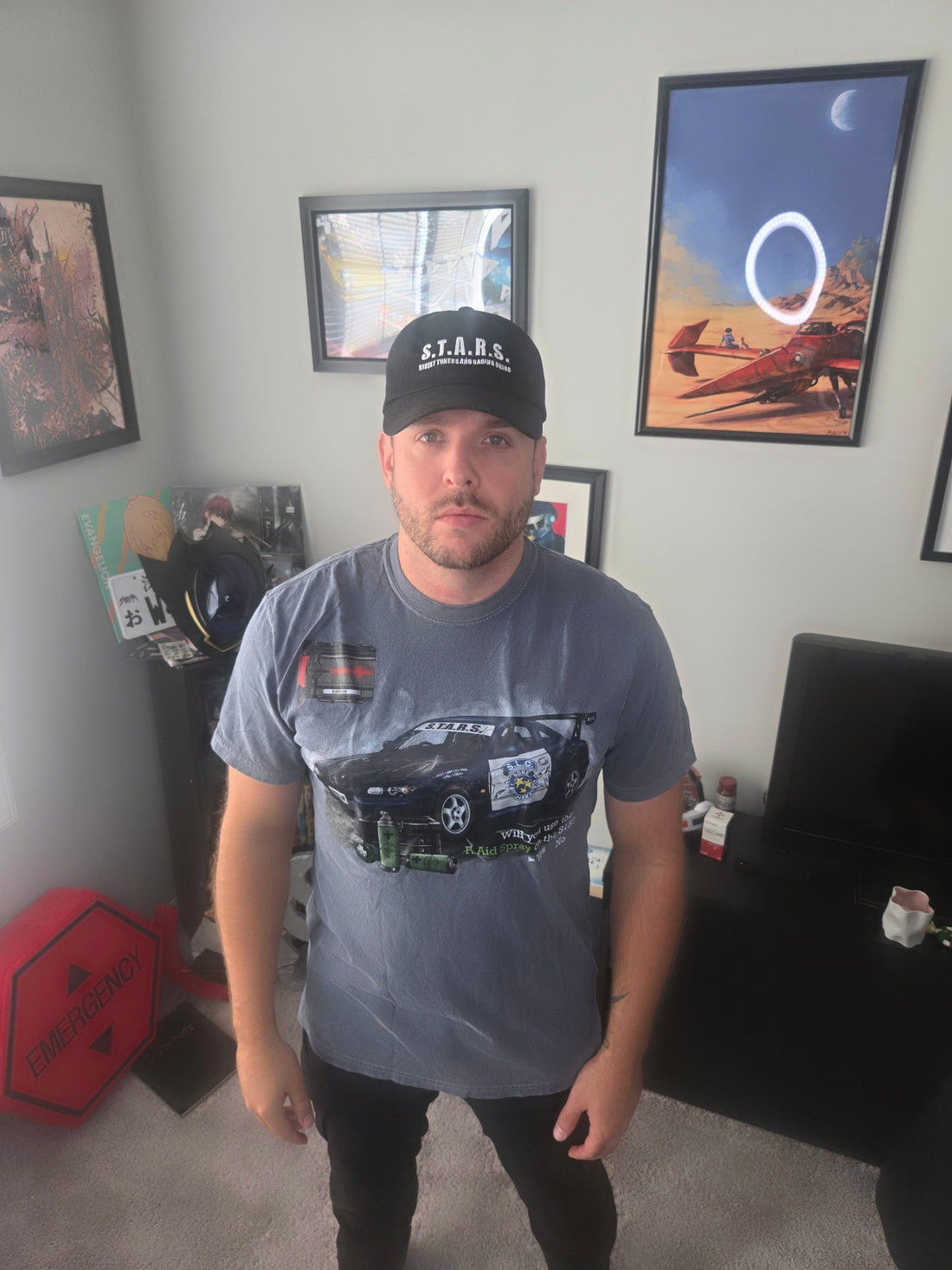 Model (5'10", 195 lb) wearing the S15 First Aid Spray Survival Horror Tee in size L, front, with the Street Tuners And Racing Squad dad hat